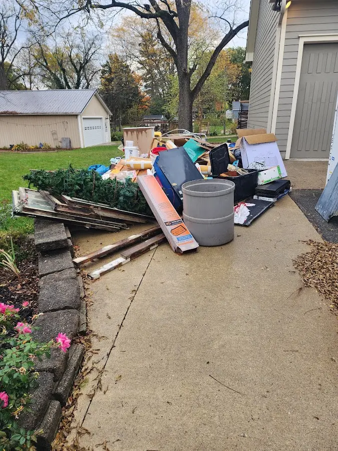 Dumpster being loaded with debris for 12 Yard Dumpster Rental in Soledad